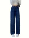 Flatlay of Newness Parisian High Waisted Wide Leg Jeans in a stylish setting The durable denim and flattering wide leg silhouette are highlighted