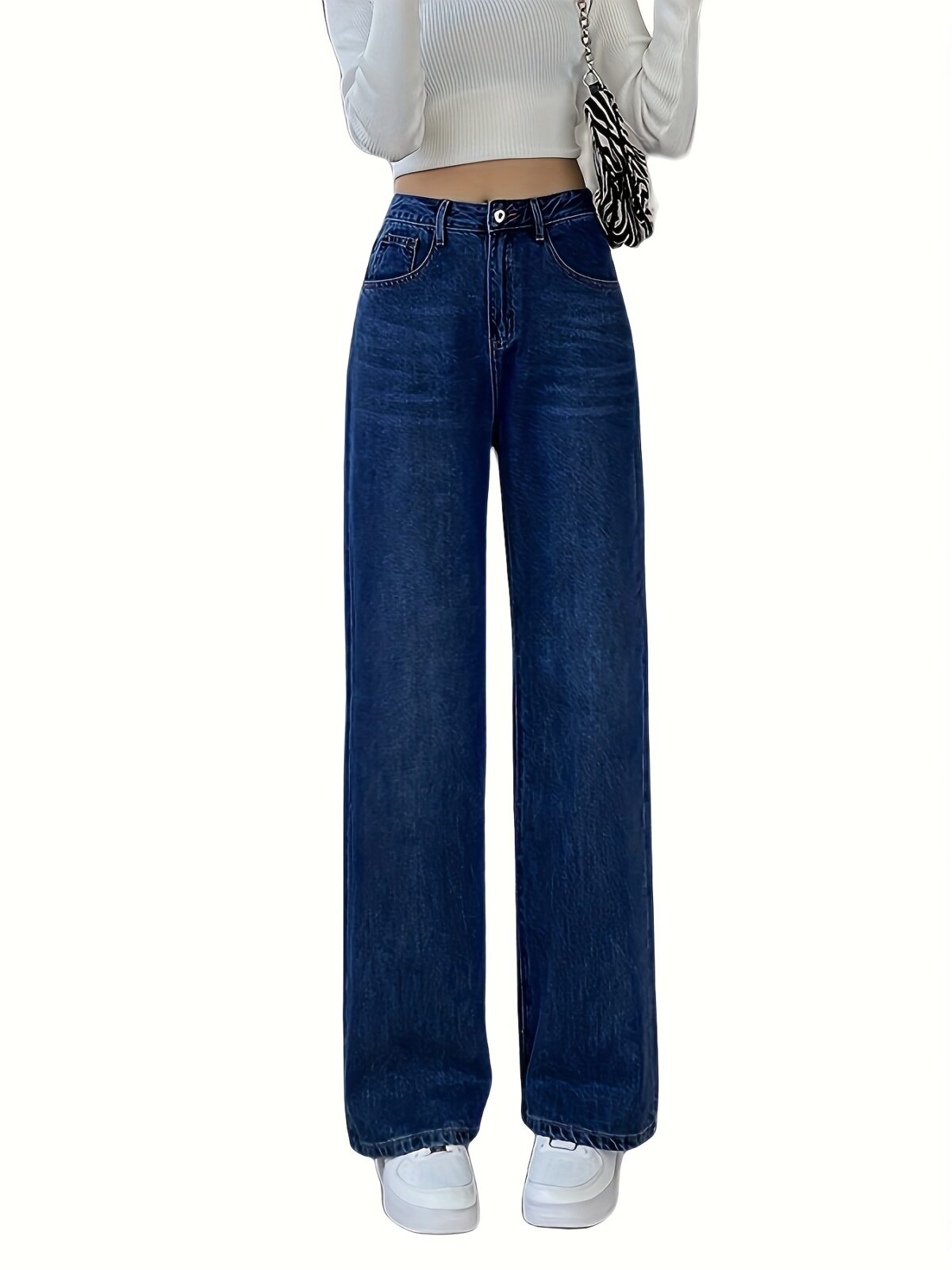 Flatlay of Newness Parisian High Waisted Wide Leg Jeans in a stylish setting The durable denim and flattering wide leg silhouette are highlighted