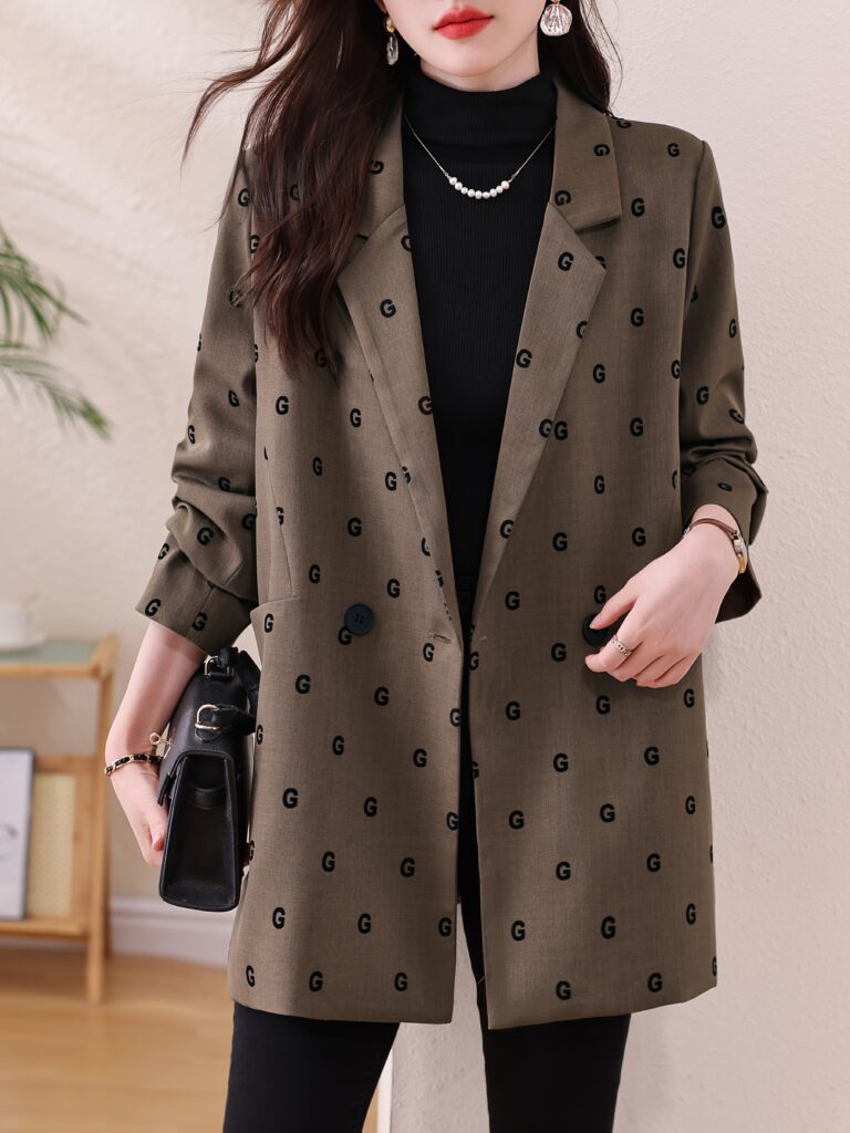 A stylish woman confidently poses wearing the Newness Autumn Chic Women's Loose Elegant Blazer, showcasing its flattering silhouette and effortless elegance. The blazer is draped casually over her shoulders for a relaxed look.