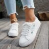 Newness Blush Butterfly Lace Up Sneakers Chic blush colored sneakers with butterfly accents and lace up closure perfect for spring