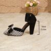 Chic black and white houndstooth plaid bow pumps Mary Jane style pointed toe comfortable block heel Dubai design