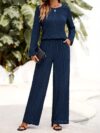 The Newness Milan Solid Color Pantsuit in a flattering pose This chic pantsuit crafted from smooth polyester is perfect for spring and fall The model showcases its versatile style and sophisticated fit