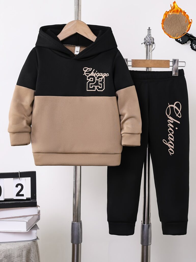 Stylish boys' color block fleece-lined hoodie and pants set in vibrant colors, perfect for outdoor play or casual wear. The Newness brand logo is subtly displayed.