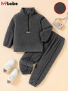Newness Cozy Comfort Boys Winter Fleece Set A stylish and cozy two piece fleece set for boys perfect for keeping warm during winter The image shows a boy wearing the set showcasing its soft fleece fabric and trendy design