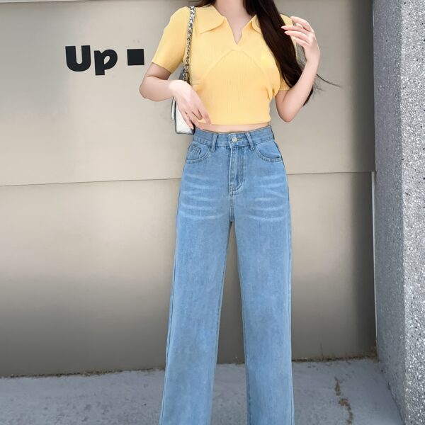 Glacier blue embroidered wide leg jeans from Newness showcasing intricate embroidery and a flattering wide leg silhouette