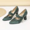 A pair of retro style embroidered womens high heel shoes in a pointed toe design