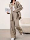 Beige Minimalist Casual Two Piece Set A stylish and comfortable beige jacket and pants set perfect for fall and winter Model showcases effortless chic