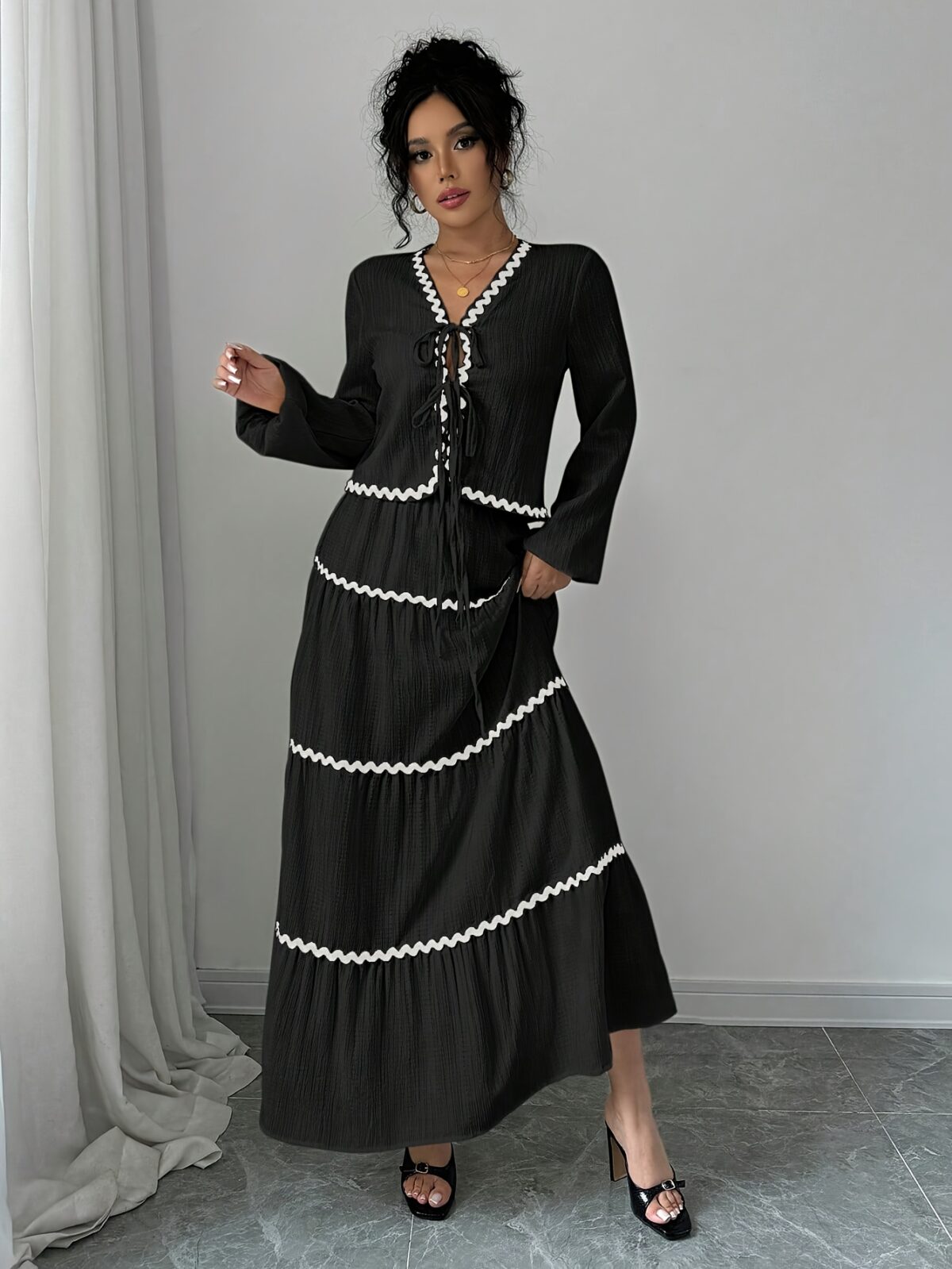 Effortlessly chic Casablanca Tiered Maxi Skirt Set from Newness Model showcasing the complete set featuring a flowing maxi skirt with tiers and a coordinating top