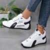 Newness Nova Minimalist White Sneakers A pair of sleek white minimalist sneakers showcasing comfort and versatility ideal for any occasion