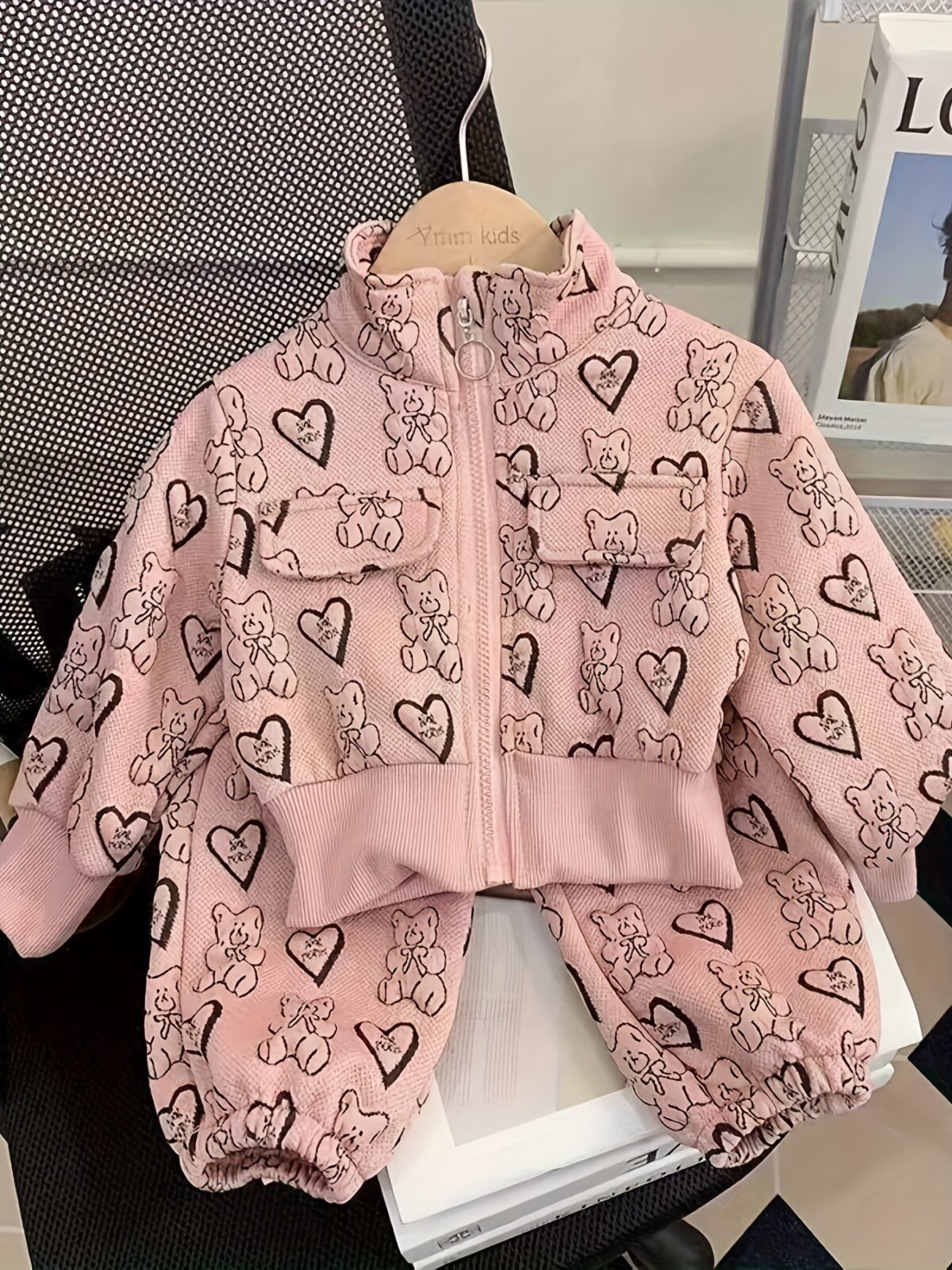 Girl wearing a stylish and windproof Newness Safari Dreams animal print set perfect for outdoor adventures