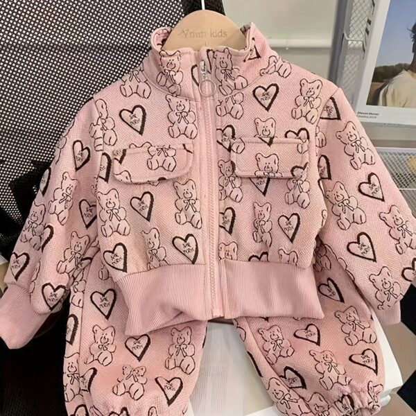 Girl wearing a stylish and windproof Newness Safari Dreams animal print set, perfect for outdoor adventures.