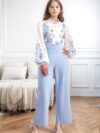 Girl wearing a whimsical floral print outfit ideal for spring and autumn