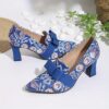 Newness Printed Mary Jane Pumps with Bow Embellishment Chic and comfortable pumps featuring a vibrant print and delicate bow detail perfect for any occasion