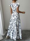 Embrace summer in the Newness Casablanca Floral Print Maxi Dress A chic flowing maxi dress with a vibrant floral print perfect for any occasion