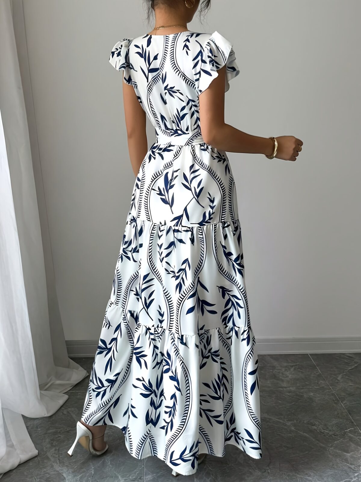 Embrace summer in the Newness Casablanca Floral Print Maxi Dress A chic flowing maxi dress with a vibrant floral print perfect for any occasion