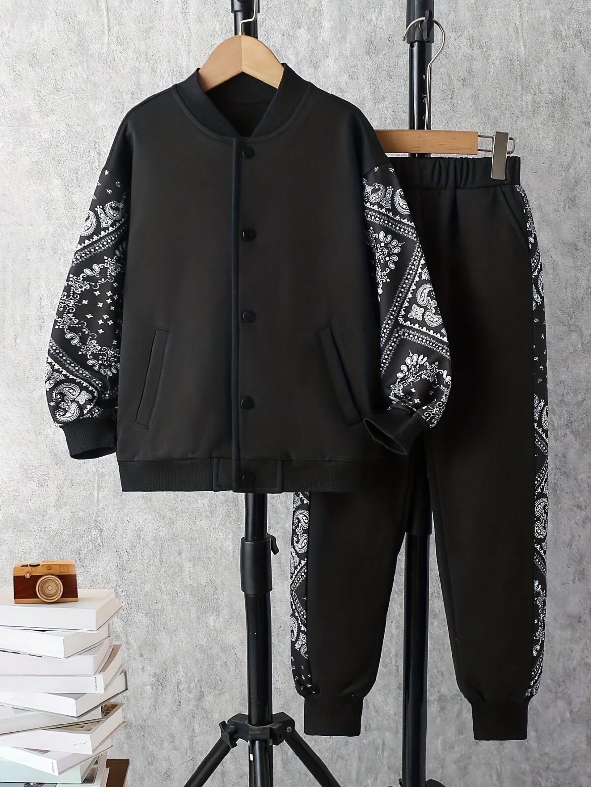 Stylish boys geometric pattern tracksuit set in a comfortable polyester blend perfect for FallWinter Machine washable for easy care From Newness