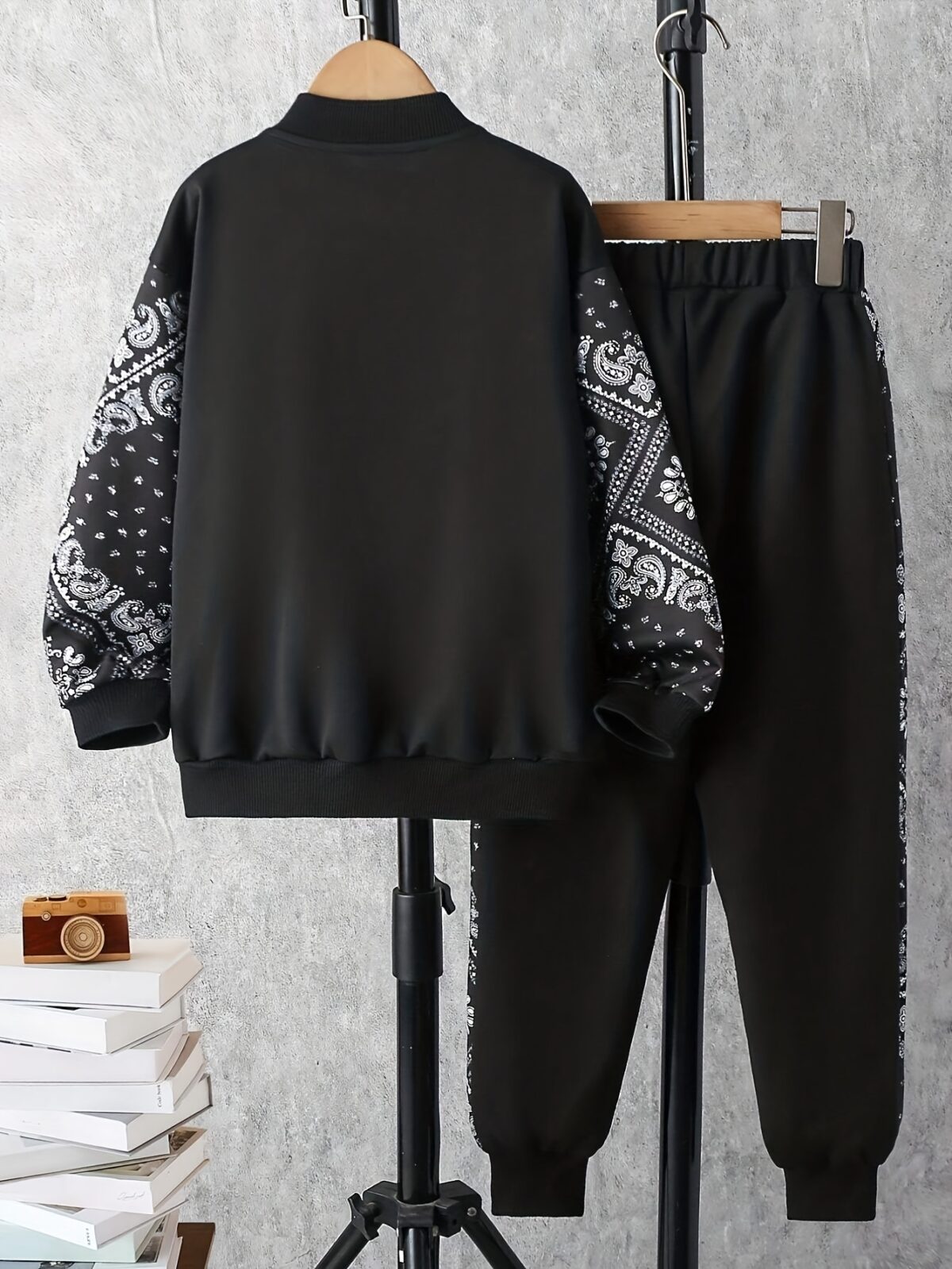 Stylish boys geometric pattern tracksuit set in a comfortable polyester blend perfect for FallWinter Machine washable for easy care From Newness