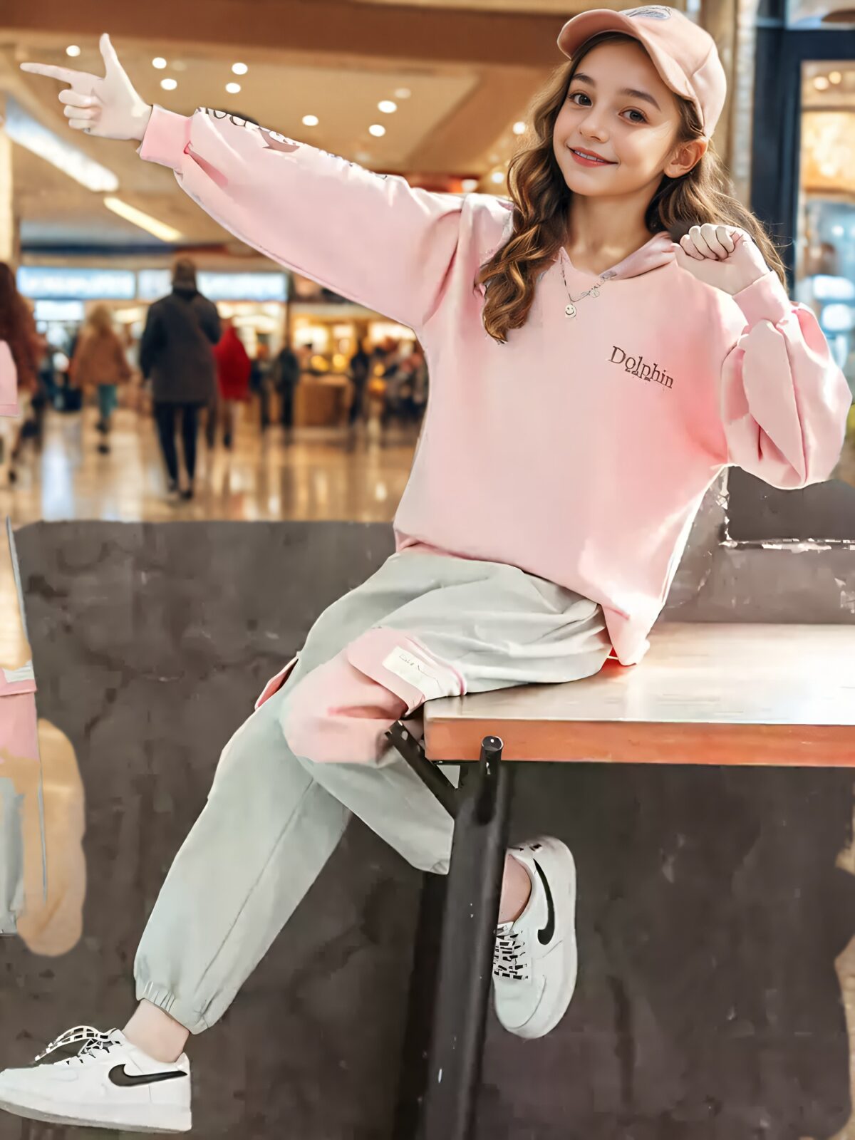 Adorable girls playful dolphin print suit in a comfortable loose fit perfect for spring and fall