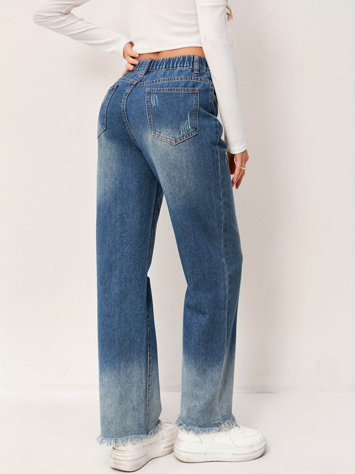 Newness Effortless Chic Straight Leg Jeans Flattering straight leg jeans in a versatile wash designed for both comfort and style Model showcases the perfect fit and drape