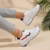 Newness City Chic White Accent Sneakers Modern white sneakers with stylish accents perfect for any occasion