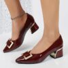 Womens black Mary Jane heels with gold buckle straps and chunky mid heel