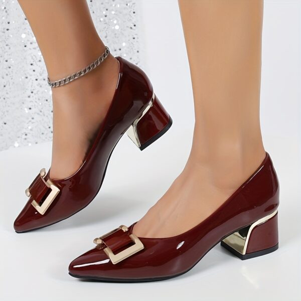 Women's black Mary Jane heels with gold buckle straps and chunky mid-heel