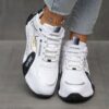 Newness City Chic Striped Athletic Sneakers Stylish striped sneakers perfect for everyday wear Close up view showcasing the chic design and comfortable athletic build