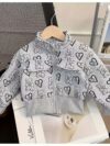 Girl wearing a stylish and windproof Newness Safari Dreams animal print set perfect for outdoor adventures