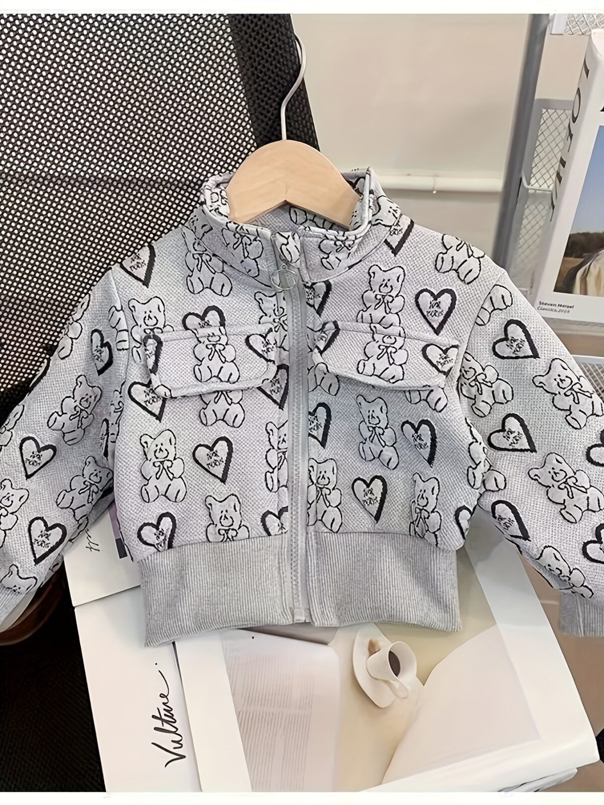 Girl wearing a stylish and windproof Newness Safari Dreams animal print set perfect for outdoor adventures