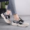 Pair of womens breathable mesh casual sneakers in white low top design with lace up closure and soft knit insole