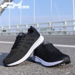 Womens breathable mesh running shoes in pink showing side and front view