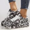 Newness Street Chic Graffiti Print Sneakers Elevate your street style with these chic comfortable and durable sneakers featuring a bold graffiti print