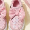 Pink and white girls princess sneakers with bows and heart accents showcasing their sparkly design and comfortable features Perfect for spring fall school or playdates