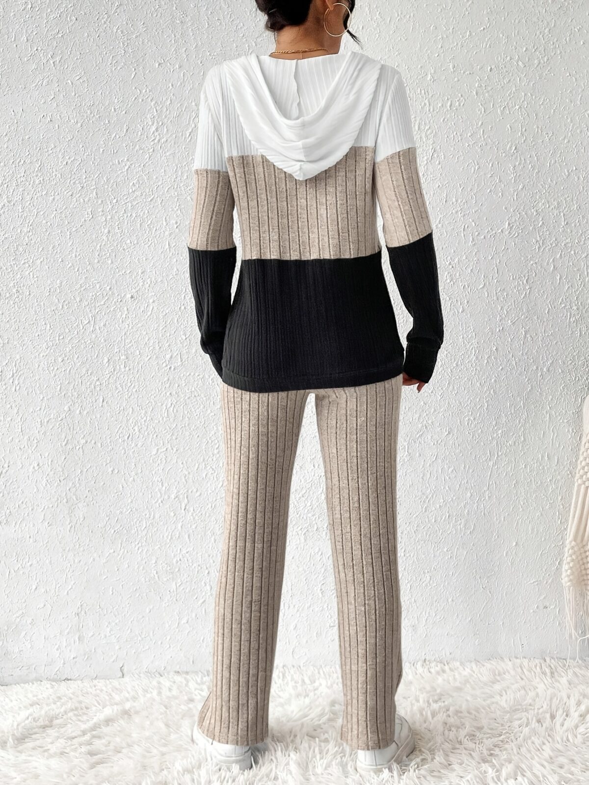 The Newness Riviera Color Block Hoodie Set in a flattering pose showcasing its vibrant color blocking and comfortable fit Perfect for spring or fall