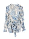 Effortlessly chic Riviera Romance floral print two piece set featuring a long sleeve shirt and wide leg pants perfect for all seasons