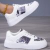 Whimsical White Cartoon Style Sneakers by Newness Chic comfortable and effortlessly cool white sneakers with a cartoon inspired design