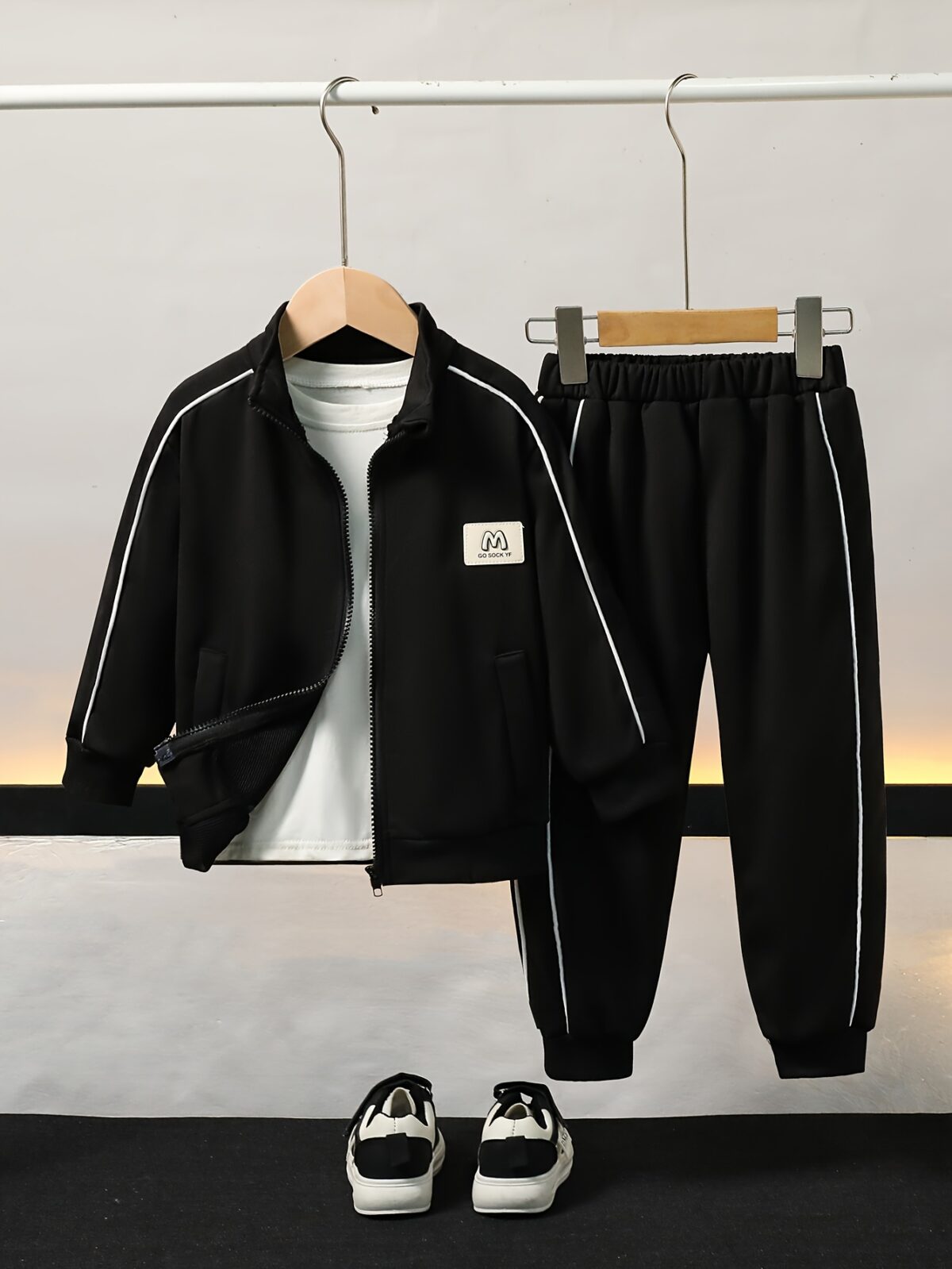 Stylish boys tracksuit set in navy blue with white stripes perfect for active play or casual wear Features a comfortable long sleeve jacket and matching pants