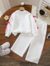 Adorable girls two piece autumn outfit cozy knit top and loose fitting pants perfect for fall adventures Dubai design