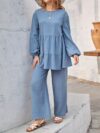Newness Dahlia Ruffled Two Piece Set A stylish and comfortable two piece outfit featuring a ruffled design