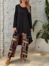 Model showcasing the Newness Casablanca Abstract Print Set a stylish two piece outfit with a solid color top and vibrant abstract print pants
