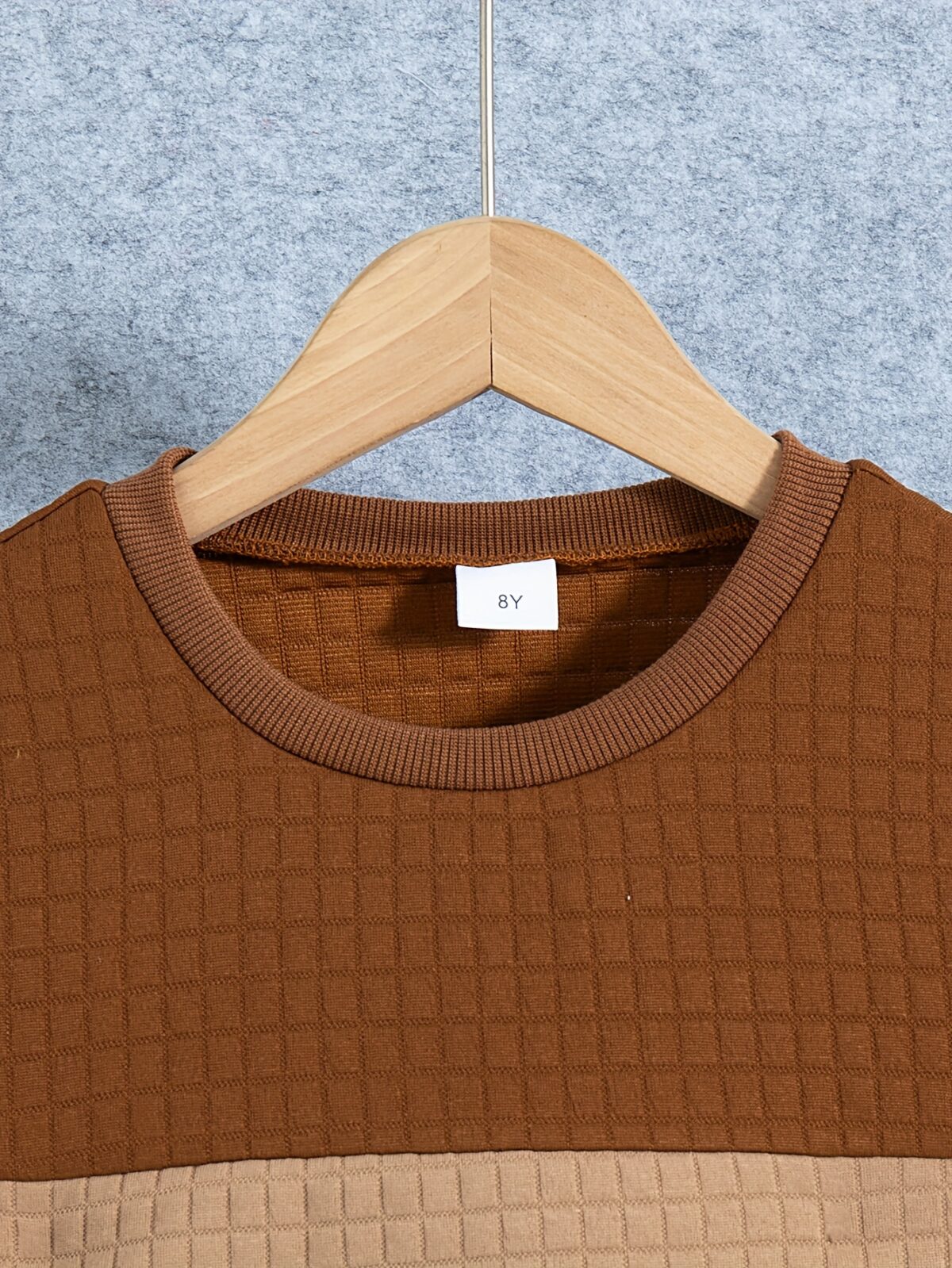 Stylish boys two piece outfit featuring a comfortable long sleeved knit pullover and trendy cargo pants perfect for spring and fall adventures