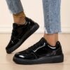 Newness Sleek  Chic Womens Glossy Sneakers in white showcasing their glossy finish and comfortable design Perfect for effortless style