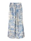 Effortlessly chic Riviera Romance floral print two piece set featuring a long sleeve shirt and wide leg pants perfect for all seasons