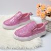 Girls glitter canvas shoes Sparkle Steps in pink showcasing the sparkly glitter fabric and comfortable design Perfect for adding a touch of glam to any outfit