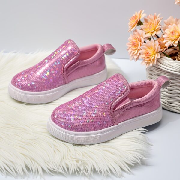 Girls glitter canvas shoes Sparkle Steps in pink showcasing the sparkly glitter fabric and comfortable design Perfect for adding a touch of glam to any outfit