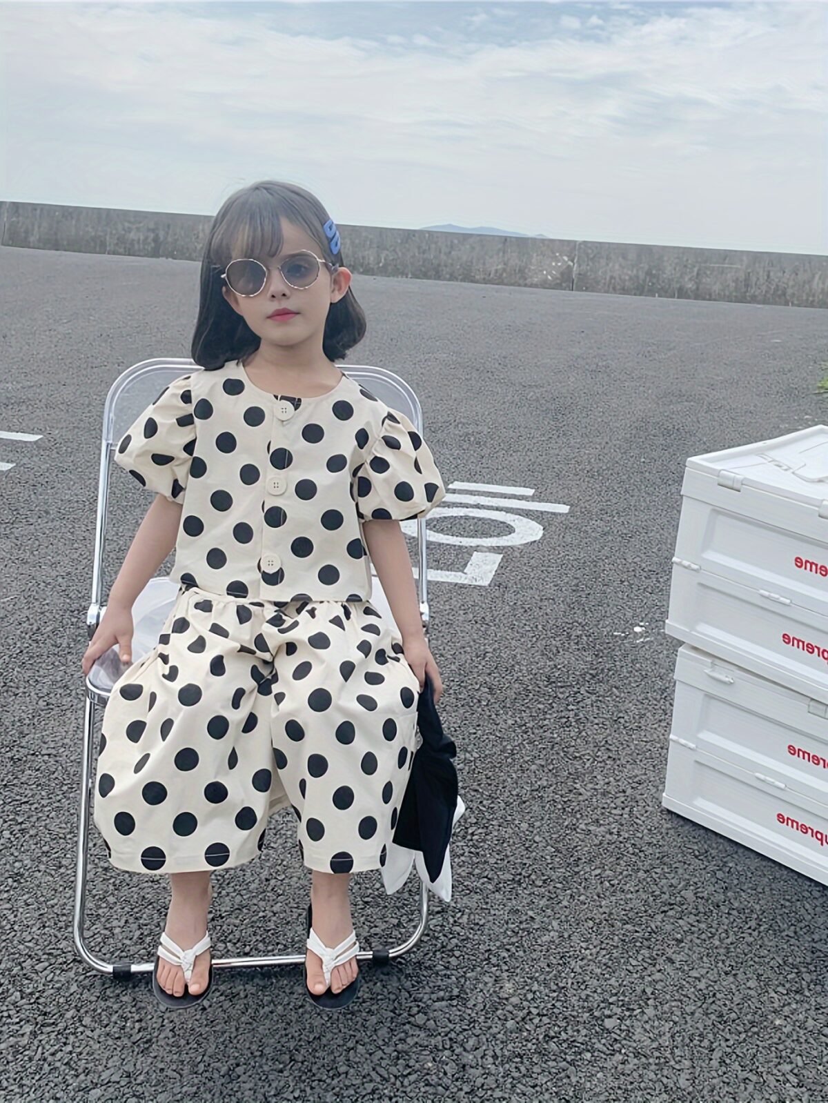 Adorable girls polka dot suit perfect for summer made from 100 soft cotton The suit features a mention specific details like sleeveless top and shorts or skirt design