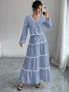 Effortlessly chic Casablanca Tiered Maxi Skirt Set from Newness Model showcasing the complete set featuring a flowing maxi skirt with tiers and a coordinating top