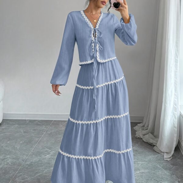Effortlessly chic Casablanca Tiered Maxi Skirt Set from Newness. Model showcasing the complete set, featuring a flowing maxi skirt with tiers and a coordinating top.