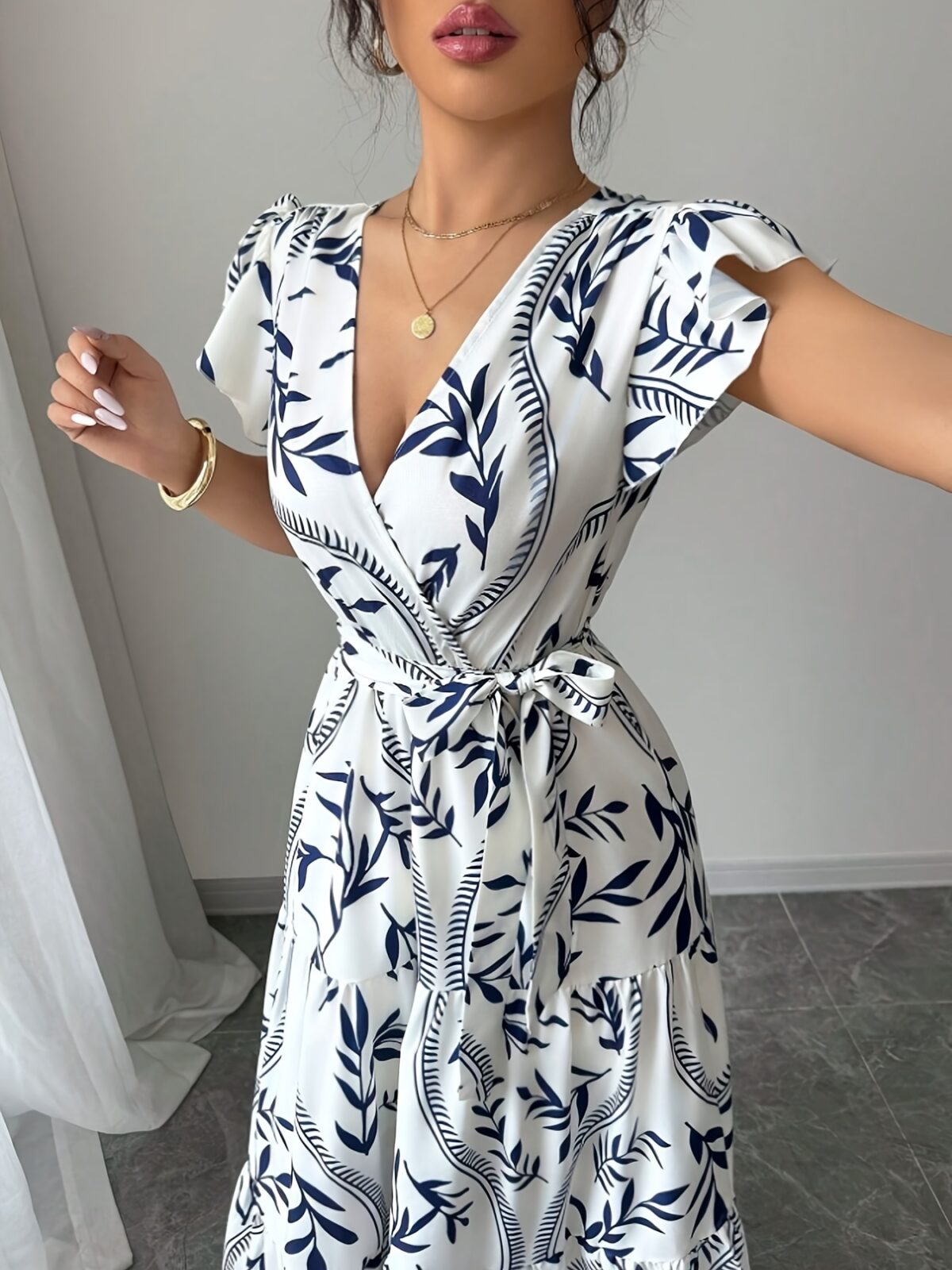 Embrace summer in the Newness Casablanca Floral Print Maxi Dress A chic flowing maxi dress with a vibrant floral print perfect for any occasion