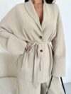 The Newness Milan Tie Waist Blazer Set a chic two piece outfit featuring a tailored blazer and matching pants cinched at the waist for a flattering silhouette Perfect for work or weekend